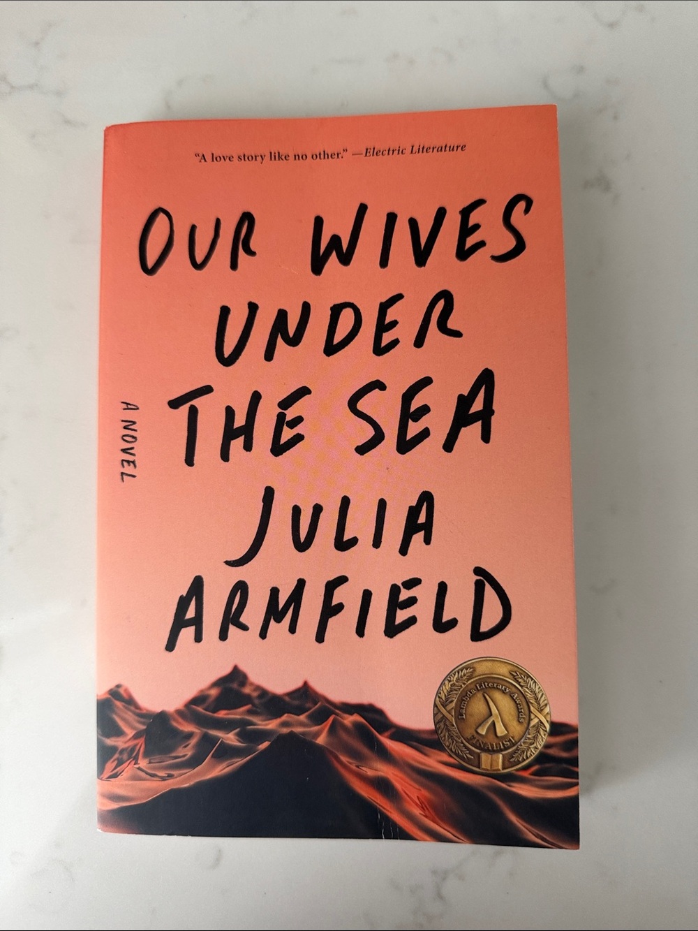 Our Wives Under the Sea by Julia Armfield - Coral & Black Paperback